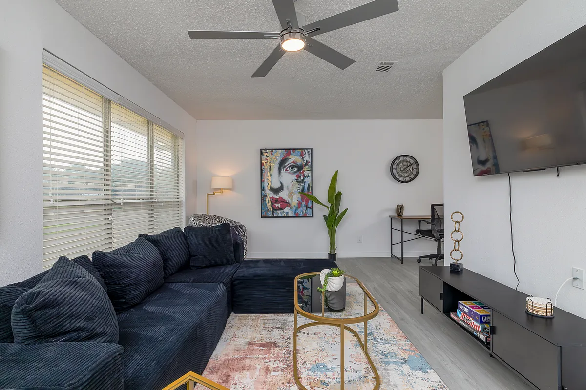Spacious living room with plenty of seating for friends and family. - 1704 Kynette Dr #A