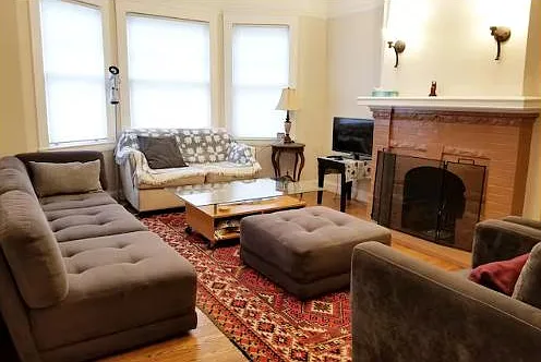 Spacious, sunny living room, plentiful comfortable seating