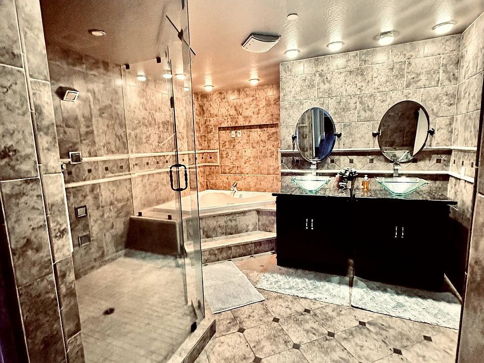 Master Bathroom with jetted tub, private toilet and vanity