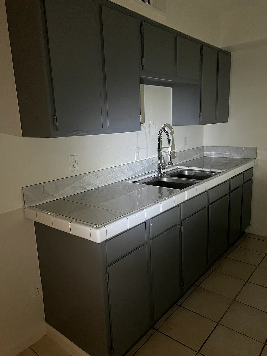 Kitchen counter tops and faucet have been remolded - 1340 E Vista Ave #4