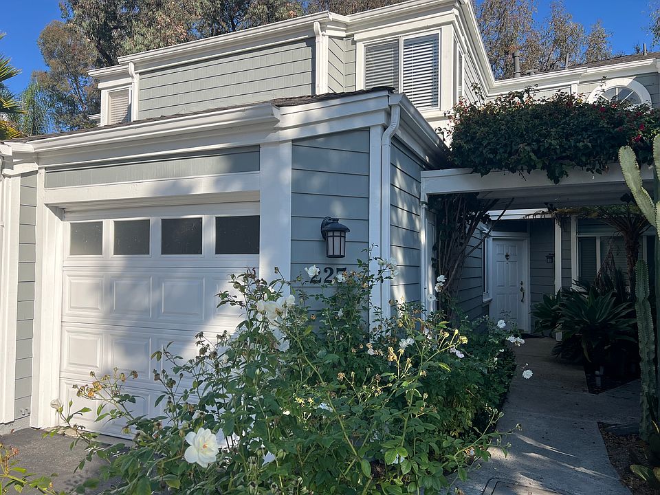Front walkway to front door and attached garage