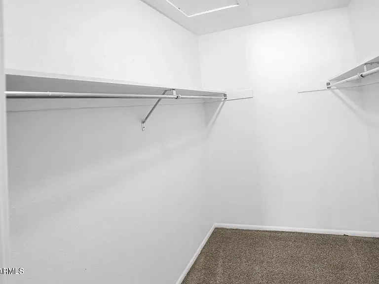 Walk-in closet in the master bedroom.