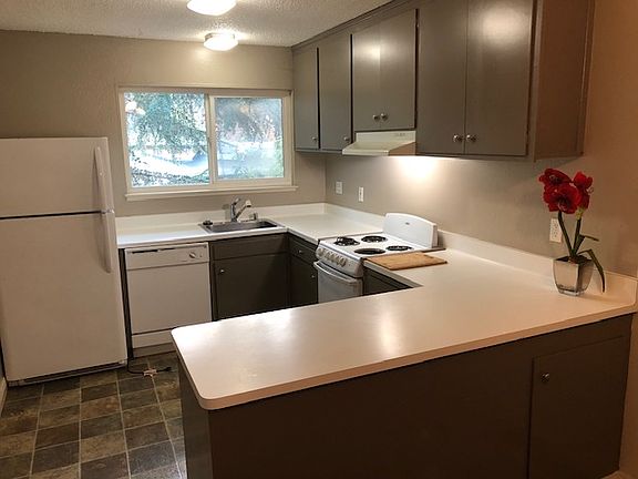 Dishwasher, Range, Refrig. Entertainment Bar Opens to Living Room