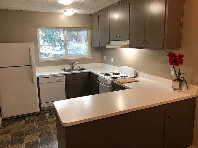Dishwasher, Range, Refrig. Entertainment Bar Opens to Living Room