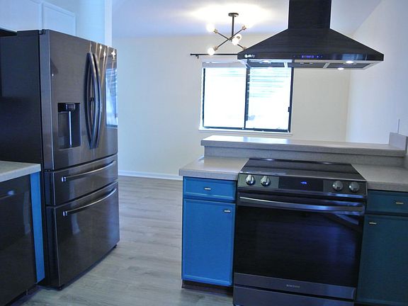Kitchen opening into dining area