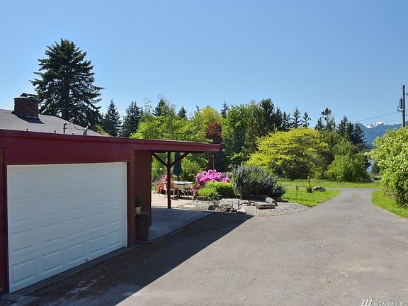 Attached garage and a peek-a-boo view of the Olympic Mountains