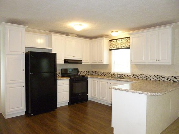 kitchen area stove and frig furnished