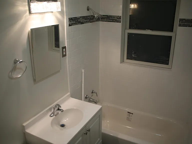 Bathroom #1: Freshly - completely remodeled with tub and backyard glazed window...very bright