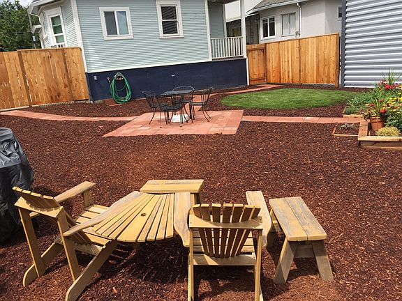 Private back yard with common areas and planting beds
