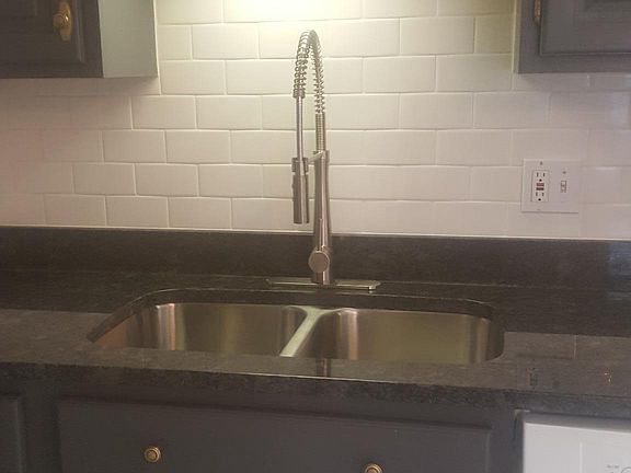subway tile, new swivel faucet with sprayer and sink