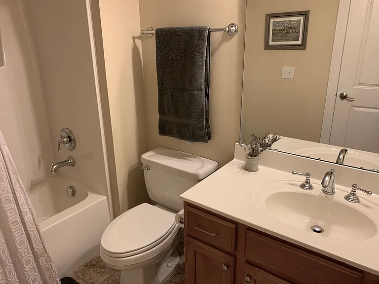 2nd bedroom bathroom with one sink and bathtub/shower combo