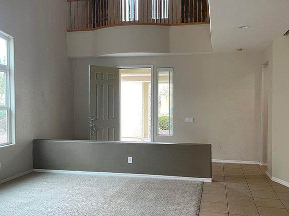 Front living room with upstairs balcony