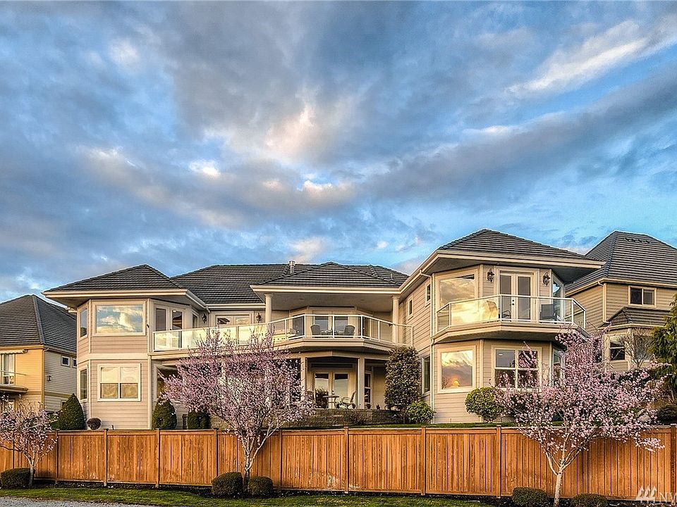 Enjoy single level living in this elegant custom built rambler with a full daylight basement that was designed by an award winning AIA architect. The lower level with 2 huge bedrooms, a full bathroom and an enormous rec room with a 2 sided gas fireplace is the perfect getaway for family and friends.