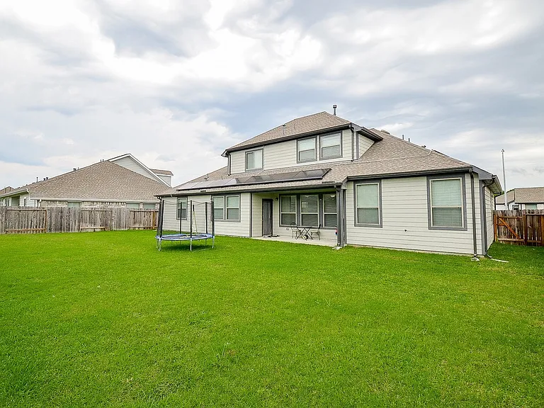 Backyard. Spacious back covered patio.