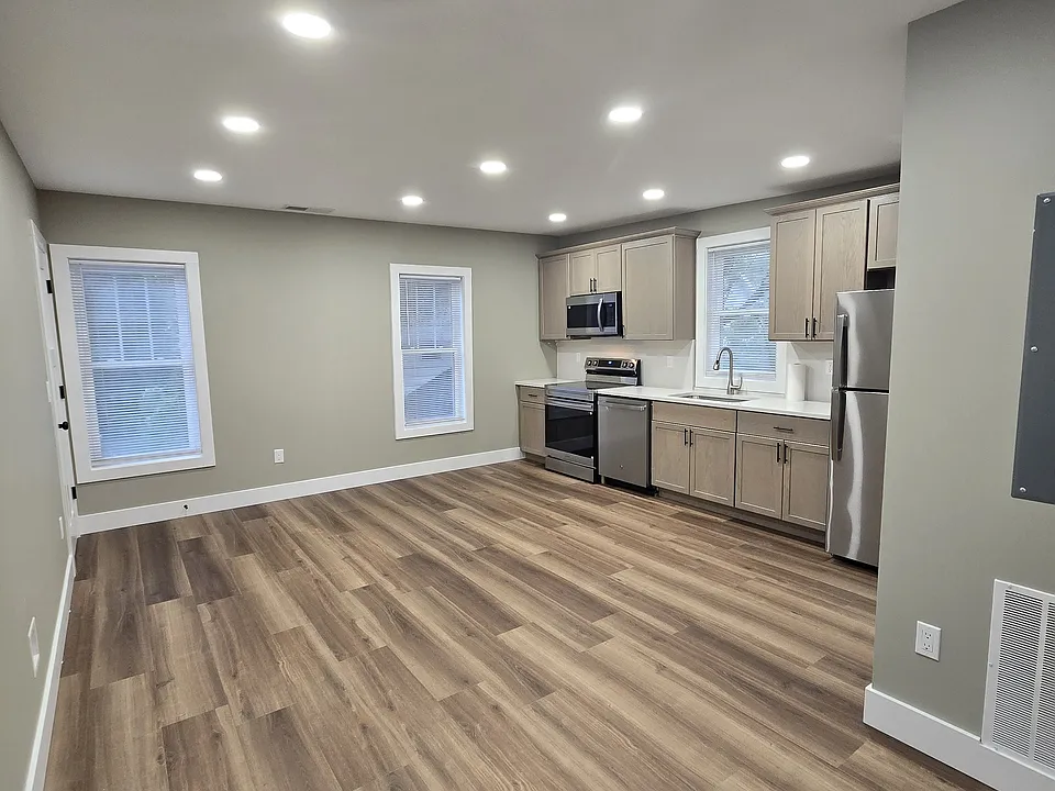 Another view of the living room kitchen open space. Lots for room here for a couch and a small eating area
