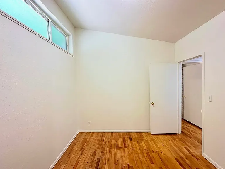 Bedroom 1: high vaulted ceiling