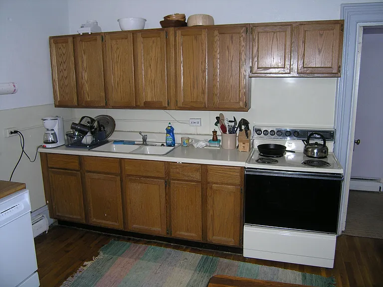 Kitchen now has a dishwasher just to the left of the stove.
