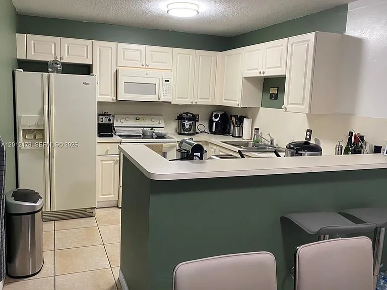 6995 NW 173rd Dr #2105 — Photo 1