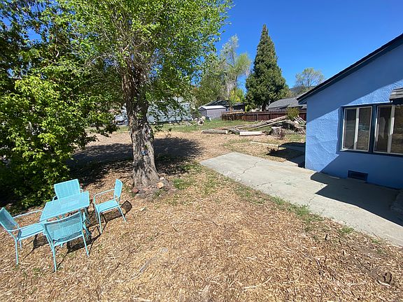 Large front yard including patio set