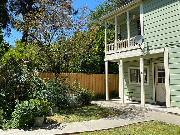 Private entry from backyard downstairs with porch area.
