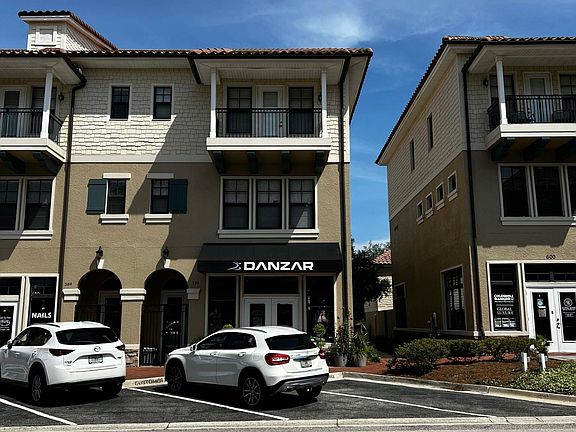 Townhome is above Danzar dance supply store. Corner unit gets natural light.