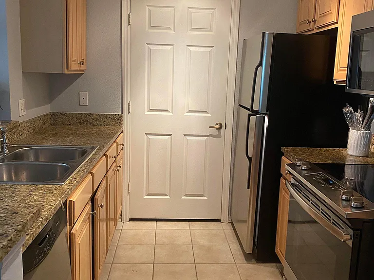 Kitchen Area - Behind the door is a Large Laundry Room with Washer and Dryer