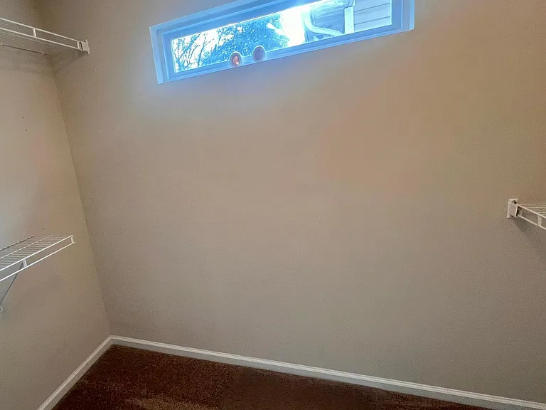 Walk in closet for master bedroom.