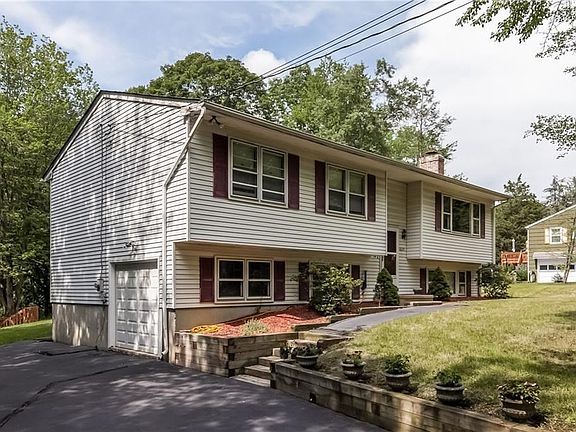 Lovely curb appeal, nicely landscaped w/retaining walls, paved driveway and a 1-car garage.