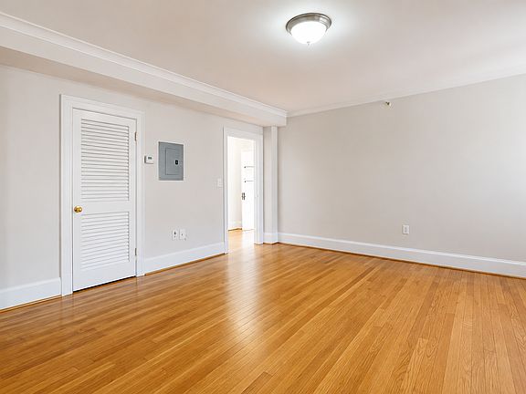 Living room facing interior hallway
