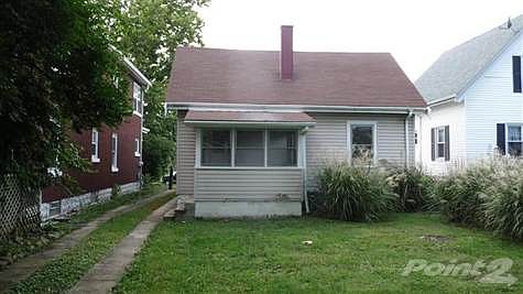 Nice enclosed back porch.  Also note the long driveway offering plenty of additional off street parking.