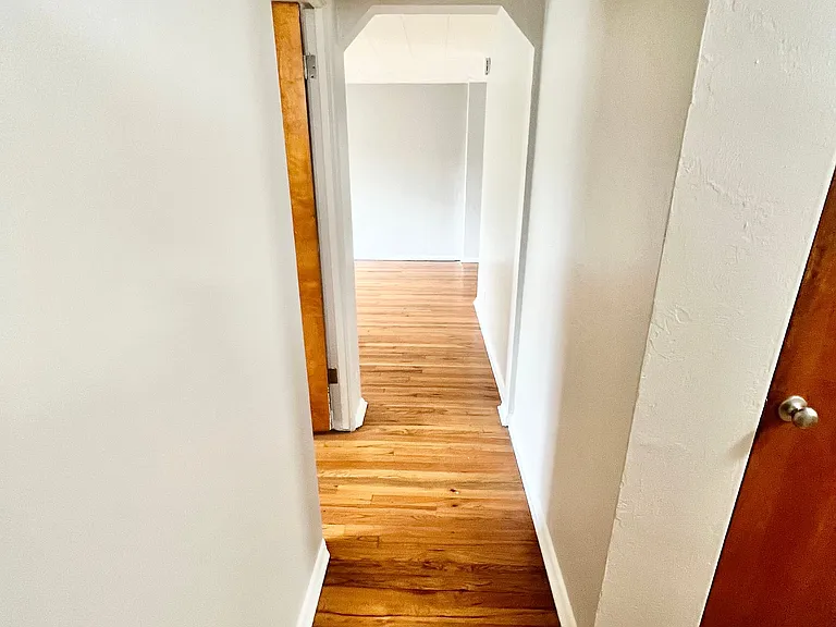 Step into this elegant hallway, leading to a spacious and modern living area. Step into this elegant hallway, leading to a spacious and modern living area.