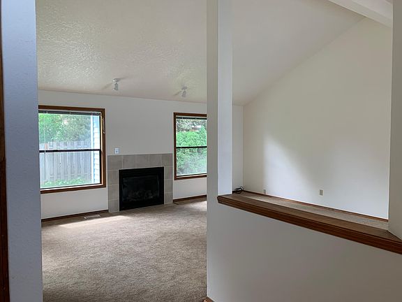 Looking into Living Room from entry area. Kitchen is on the right.