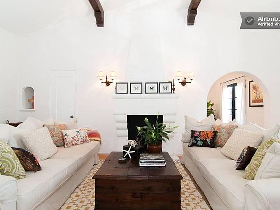 Living Room with 12' stenciled beam ceilings, hardwood floor