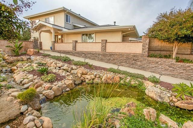 Front of main home with water feature