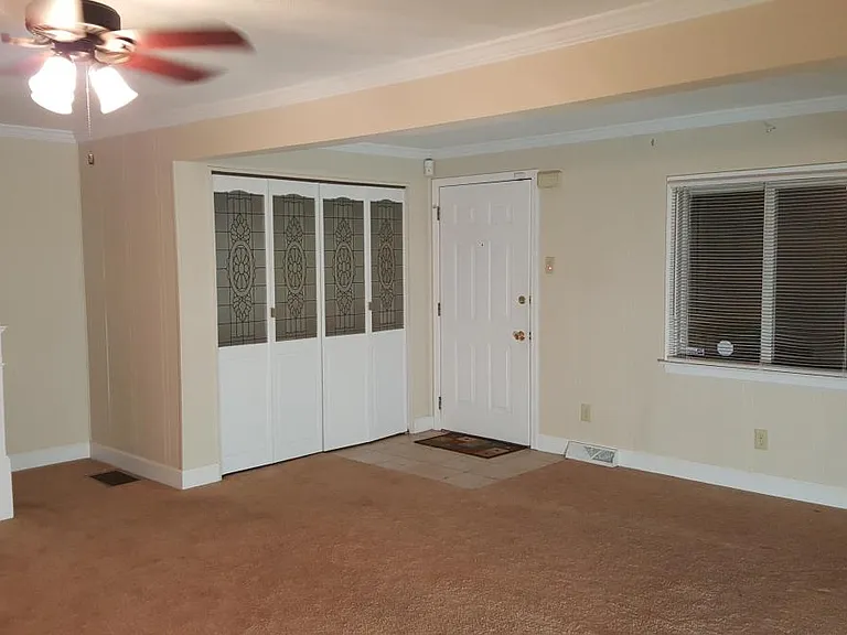 Spacious living room with large closet