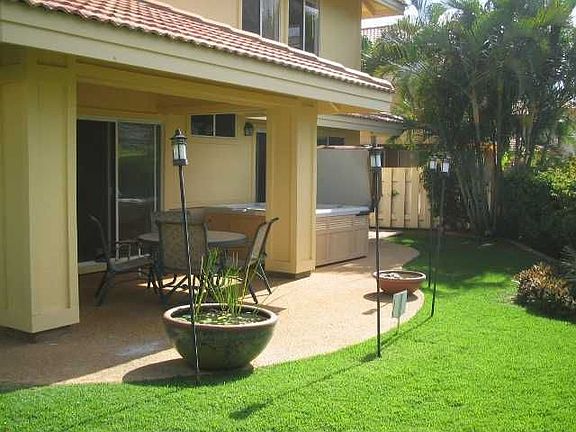 Fully landscaped backyard with private hot tub.