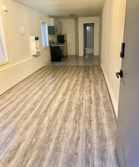 View from entry. Sleek Modern grey finishes.