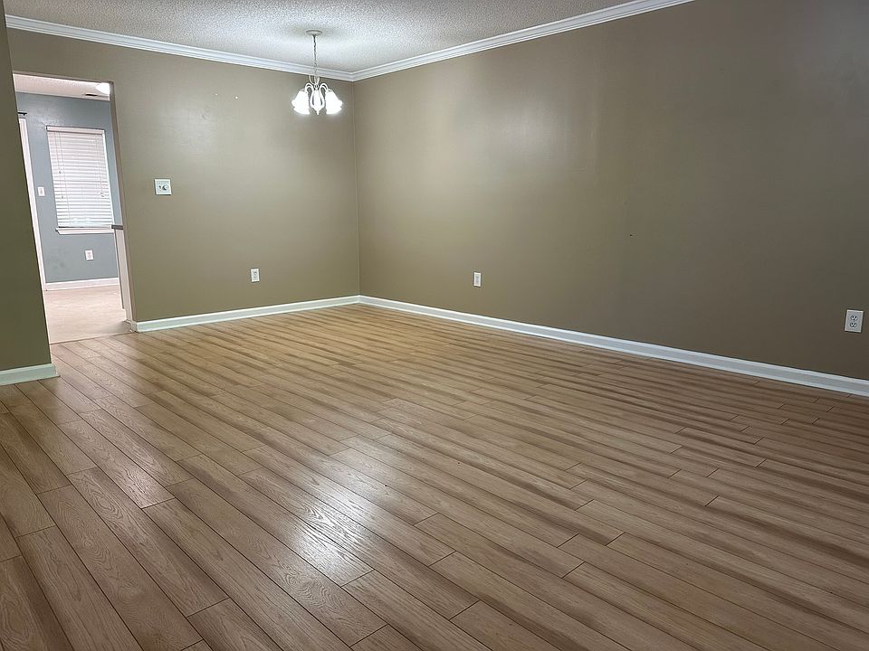 Great Room and Dining from front door and into kitchen