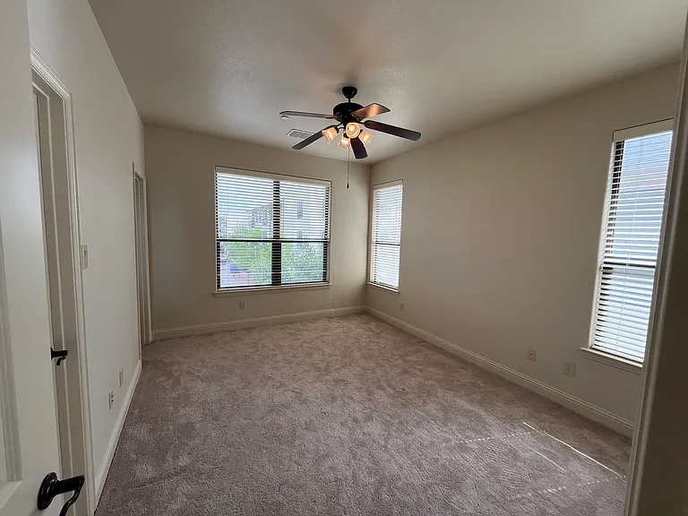 Another view of the third bedroom with plenty of light