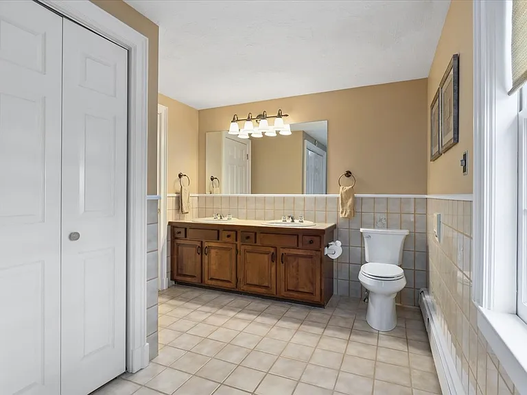 Upstairs bathroom with dual sinks.
