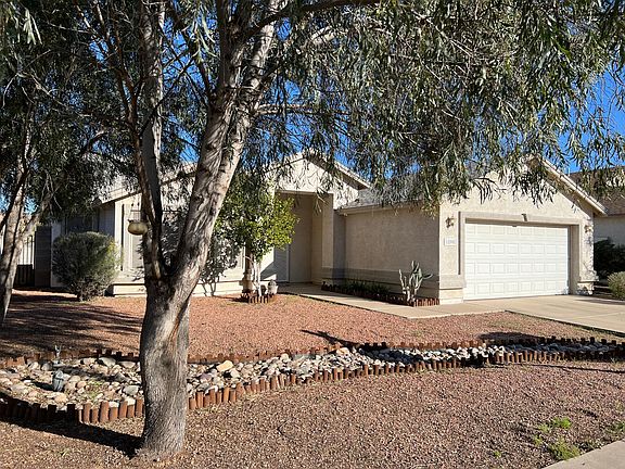 Low maintenance yard, 2-car garage and ample parking.