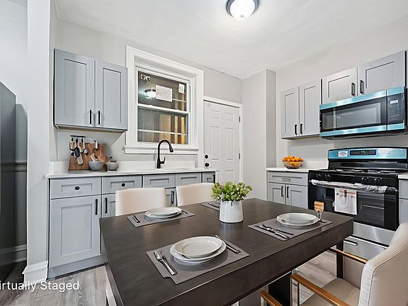 Photo is from a similar unit in the building...