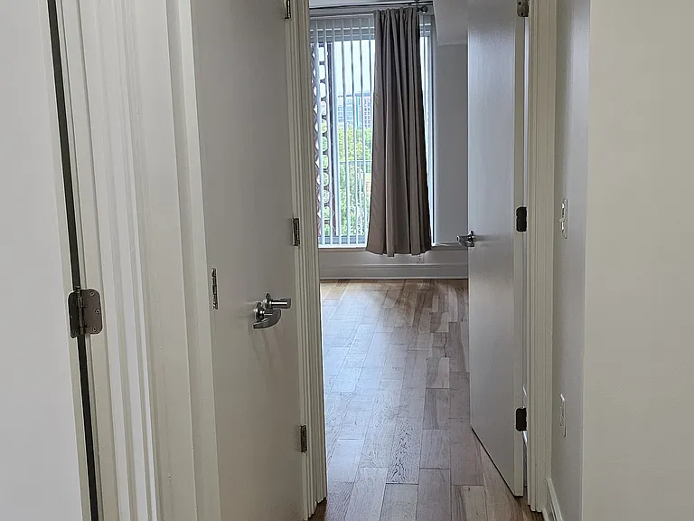 Hallway with view into Bedroom 1