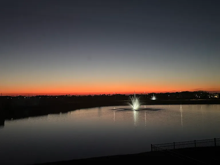 Second floor views - sunset and a lit fountain on the pond