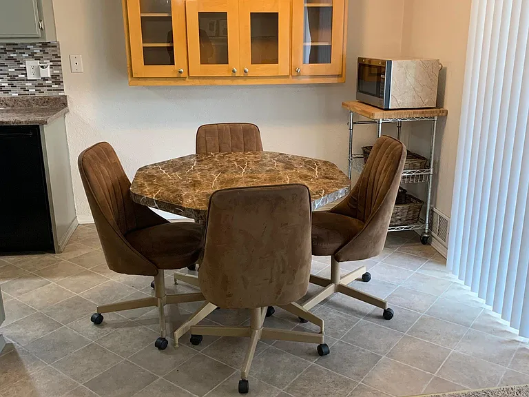 4 padded roller dinette chairs with table.