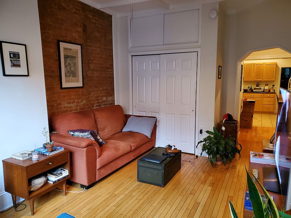 Living Room with closets and entrance to kitchen view.