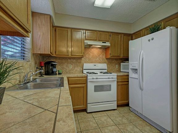Tile floors, counters & backsplash ensure clean up after meals is a breeze.