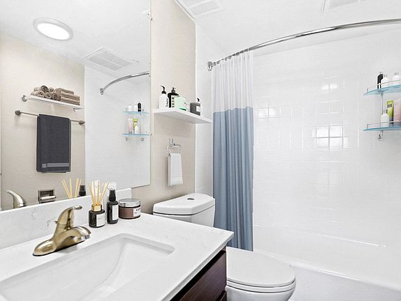Modern bathroom with clean finishes and ample counter space