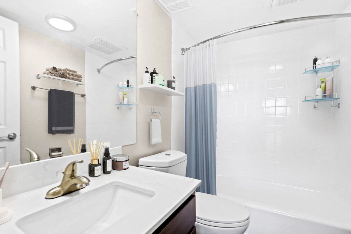 Modern bathroom with clean finishes and ample counter space