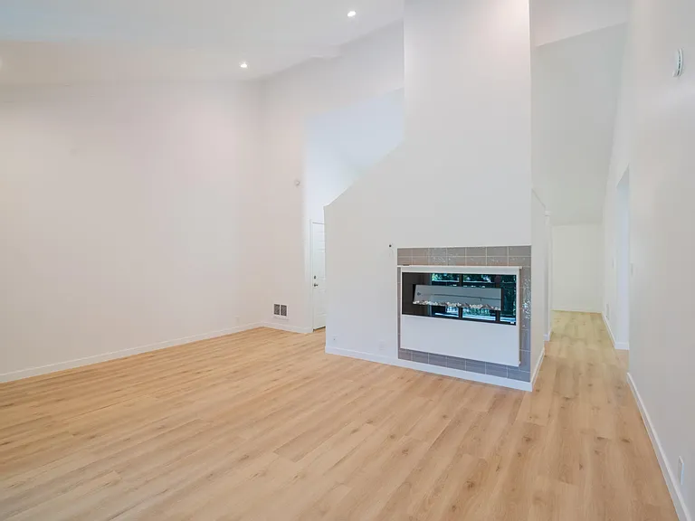 Another angle showing the large expanse of the living room with the cathedral ceilings.